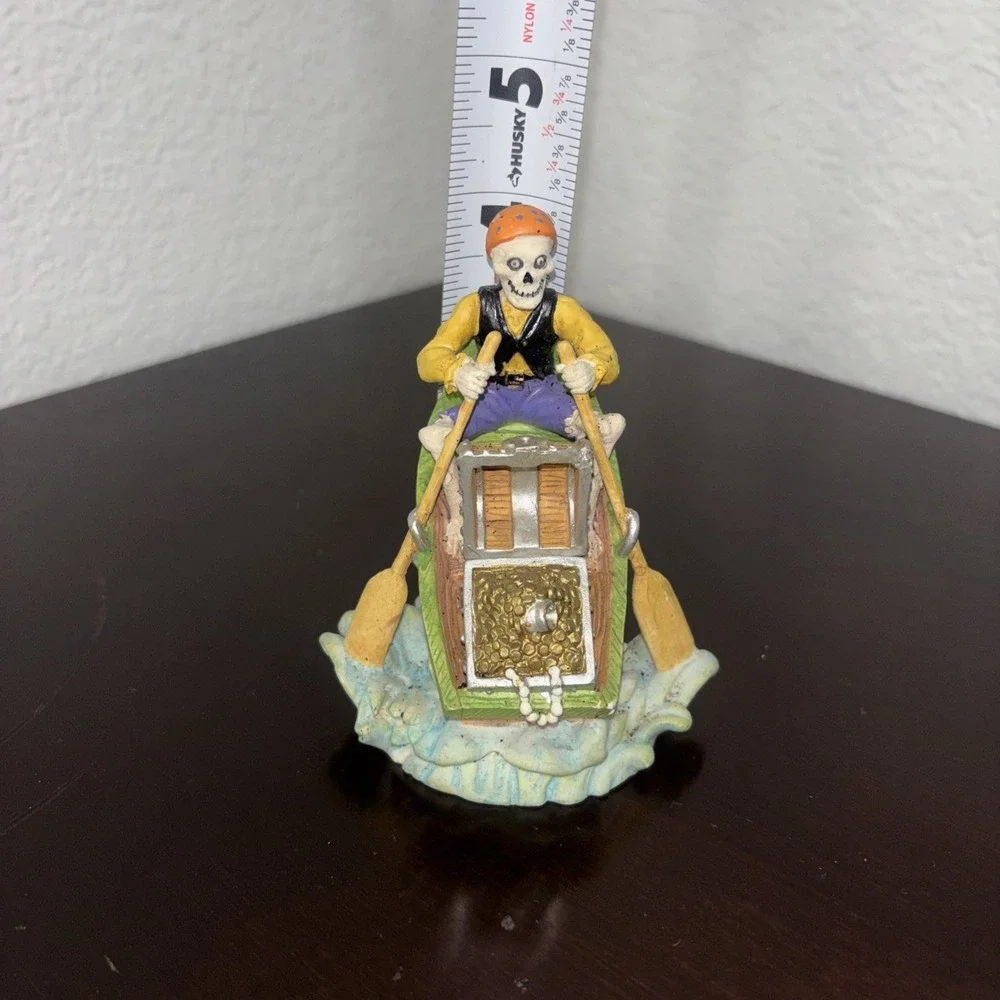 Aquarium decoration, skeleton pirate on row boat with treasure